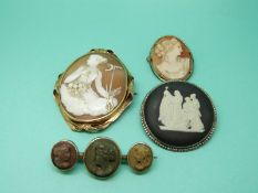 A Victorian brooch set with a cameo, a silver pendant set with lava cameos,
