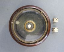 An unusual rotary dice roller and two bone dice