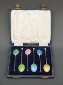 A cased set of Elizabeth hallmarked silver and guilloche enamel tea or coffee spoons,