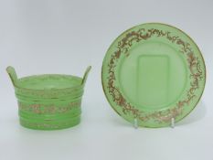 A green glass dish and plate decorated with gilt highlighted enamels, 16.