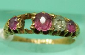 A late Victorian 18ct gold ring set with rubies and diamonds (size J/K), weight 2.