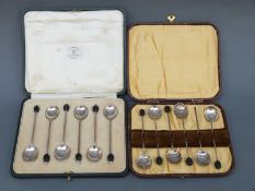 Two cased sets of hallmarked silver coffee bean spoons, one set by Mappin & Webb,