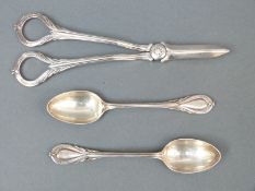 A pair of Victorian hallmarked silver grape scissors, with reed design to handles,