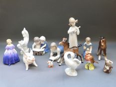 A collection of ceramic figures including Bing and Grondahl, Beswick, Royal Doulton,