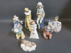 A collection of Nao figures including several clown examples,