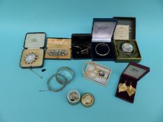 Two hallmarked silver bangles, a Victorian brooch, an enamel pot, silver gilt earrings,