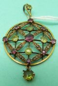 A 9ct gold Edwardian pendant set with peridot,