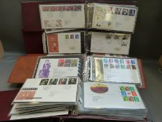 A large collection of GB first day covers in six cover albums and a box file of loose covers