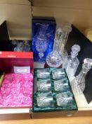A collection of cut glass to include five decanters and boxed glasses
