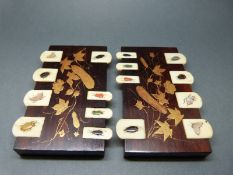A pair of 19thC Shibayama bridge counters with a foliate lacquer design and ivory, jet,