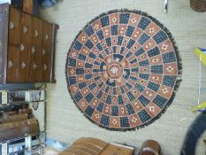A large Nigerian circular handmade leather rug or wall hanging approximately 180cm diameter