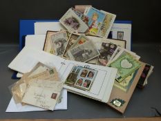 Victory and other omnibus stamp albums together with early humorous postcards,