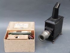 A c1900 child's magic lantern on four claw feet with adjustable lens by Bing of Nuremberg,