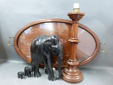 An Edwardian inlaid oval mahogany tray ebonised elephants,