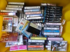 A collection of various reel to reel and cassette tapes includes jazz, classical, pop, folk,