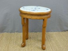 A Chinese elm stool with pierced oval blue and white porcelain seat (H50 x W40cm)