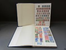 Two stockbooks of GB stamps Victoria - QE II, includes 1d penny black,