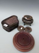 A collection of Chinese hardwood stands including a 19thC Chinese example to fit a jade boulder