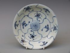 A Chinese blue and white dish, from the Tek Sing cargo wreck of 1822,