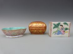 A Chinese footed dish with decoration of stylised boats and lotus,