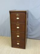 A vintage four drawer wooden filing cabinet with brass cup handles and reeded columns (H135 x W53 x