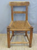 A 19thC Irish famine/hedge/folk/Arts and Crafts ash chair of peg jointed construction with braided