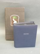 Two albums of mainly Bamforth postcards,