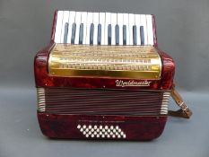 Worldmaster 32 bass (4 x 8 configuration) piano accordion in red pearloid finish,