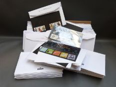 A large quantity of presentation packs and first day covers in envelopes