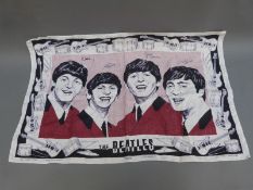 A 1960's Beatles tea towel.