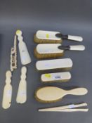 An Edwardian ivory dressing table set with white metal mounts,