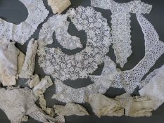 A large quantity of lace and fabric to include lengths, collars etc.