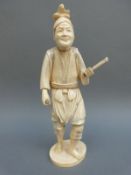 A Japanese Meiji period okimono of a man,