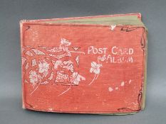 An album of early 20thC postcards,