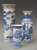 Three Chinese blue and white vases each decorated with figures and buildings,