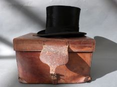 A black silk top hat by Lincoln Bennett & Co London, internal size approx. approx.