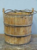 A bound/coopered wooden pail,