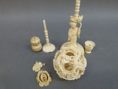 A collection of ivory stands, puzzle ball etc.