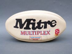 Mitre rugby ball signed by approximately 20 members of the New Zealand All Blacks squad c1990