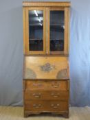 A satin walnut bureau bookcase with hand painted decoration,