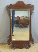 A mahogany wheatear mirror with bevelled glass (93 x 52cm)