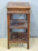 A Chinese side table with a pierced shelf below and single drawer (76cm tall)