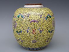 A Chinese ginger jar with enamelled decoration on a yellow ground, 17.