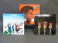 A small collection of LPs and 45s with approximately 40 CDs and further 45s with sleeves,