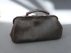 A black leather Gladstone bag approximately 36cm long