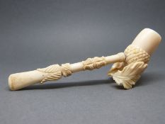 A 19thC carved ivory pipe in the form of an acorn with oak leaf,
