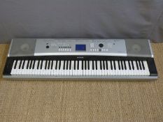 Yamaha Portable Grand DGX-520 seven and a half octave keyboard together with a pair of Phonic