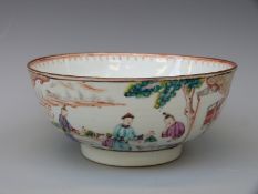 A 18thC Chinese export bowl decorated with figural scenes to the exterior and flowers to the centre,