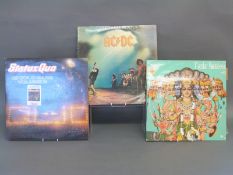 A case of LPs of mixed genres including rock,