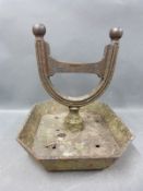 An antique cast iron boot scraper,
